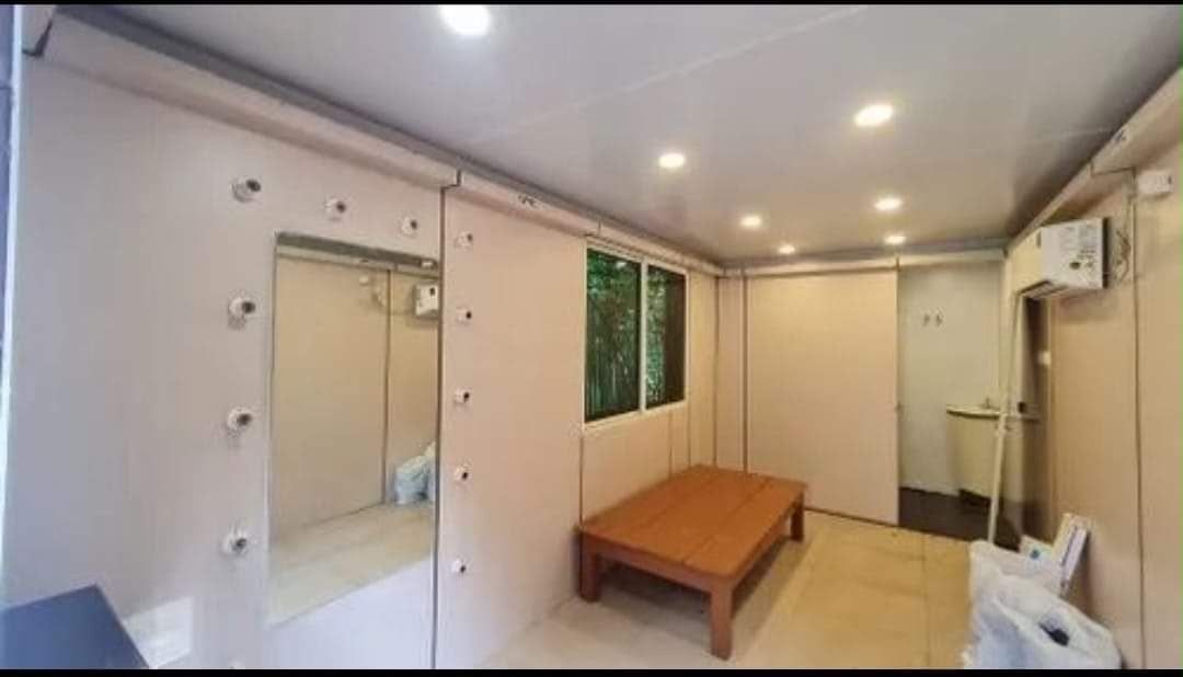 Dressing area with mirror wall, bench and attached wash area