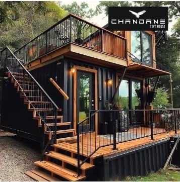 Two-storey container home with timber deck and roof terrace