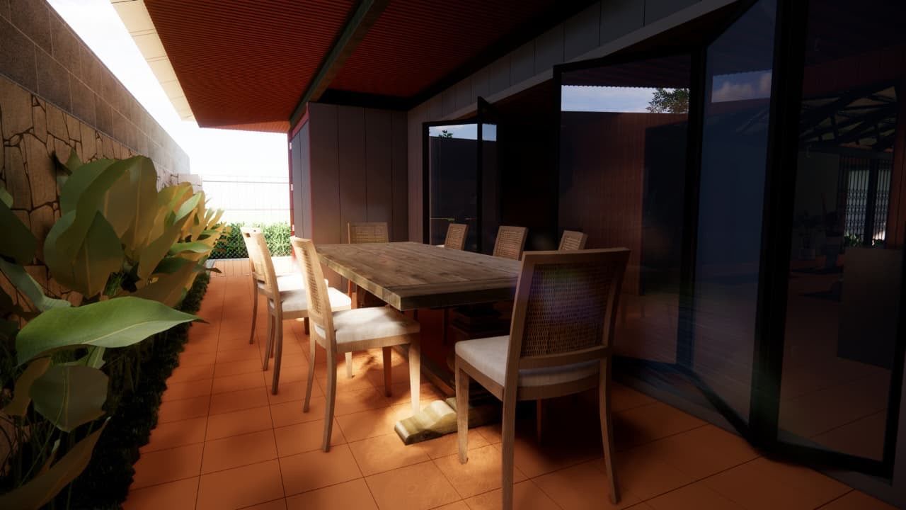 Covered dining terrace beside folding glass doors