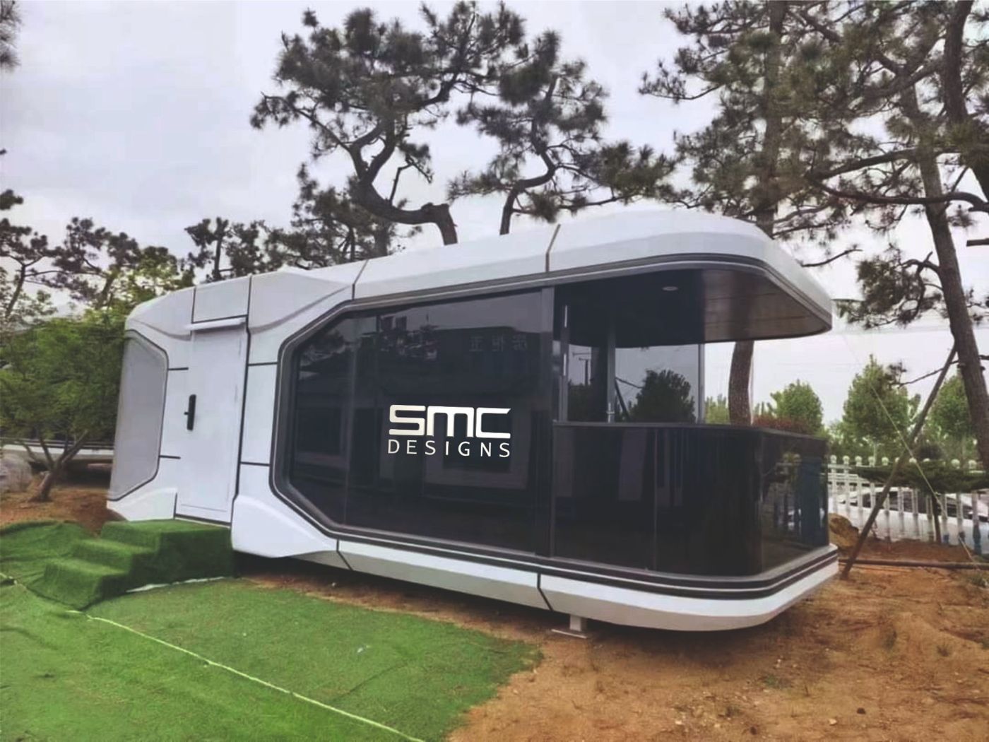 Capsule house with wraparound tinted glazing and curved shell