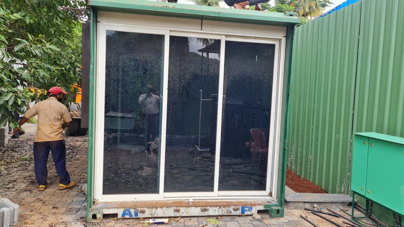 Full-height sliding glass front, craned into place